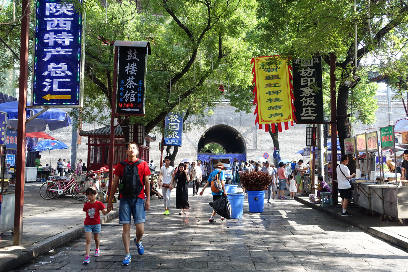 Muslim Quarter night market with neon signs and food stalls