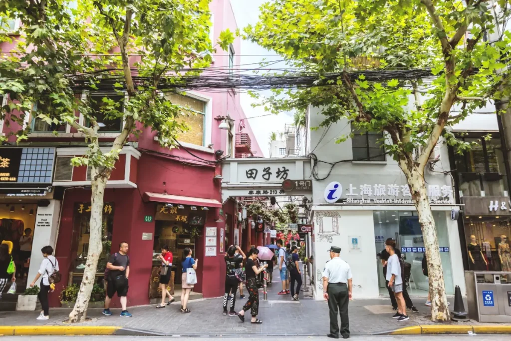 Street art and creative signage in a Tianzifang lane — the district is a living canvas for Shanghai artists