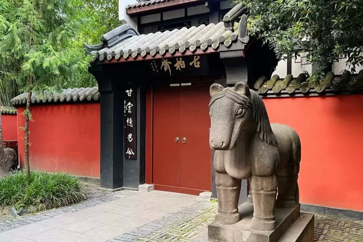 Ancient stone steles and calligraphy inscriptions lining the covered corridor at Wuhou Shrine