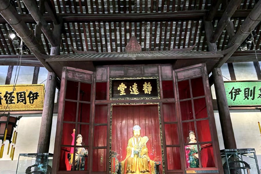 The legendary red corridor at Wuhou Shrine Chengdu with crimson pillars and traditional Chinese temple architecture